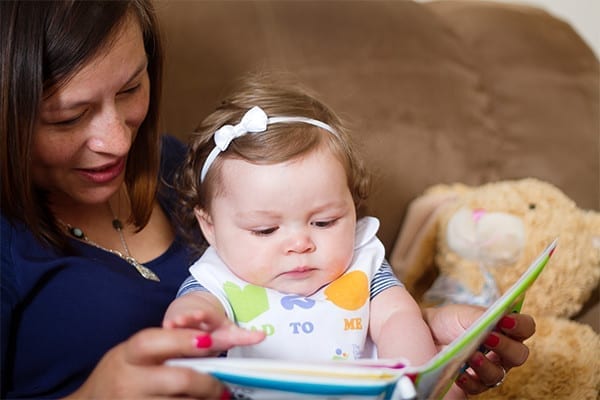 Mom reading with baby girl - CRF Phoenix